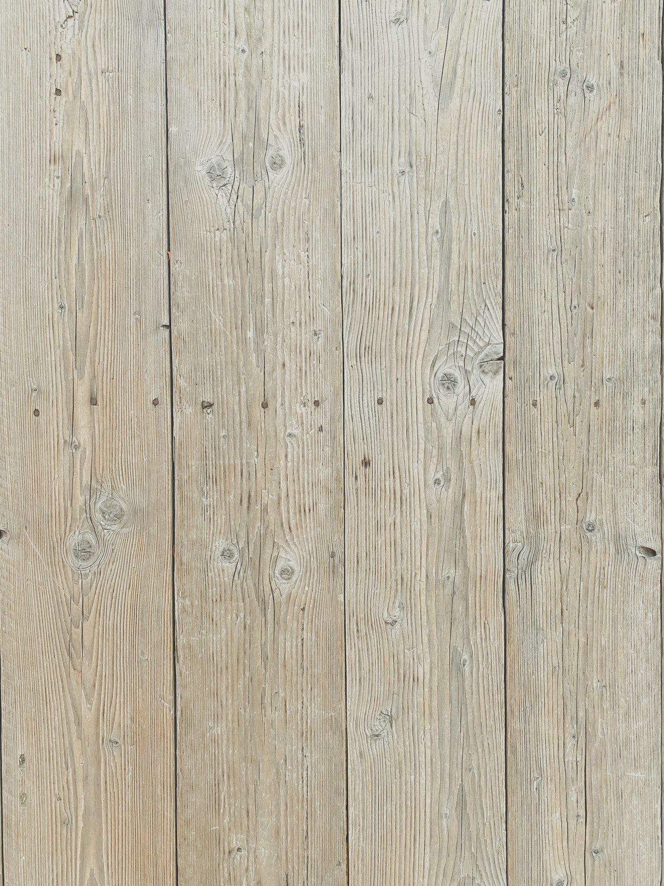 Light wood-effect flooring with visible grain and knots Light wood-effect flooring with visible grain and knots